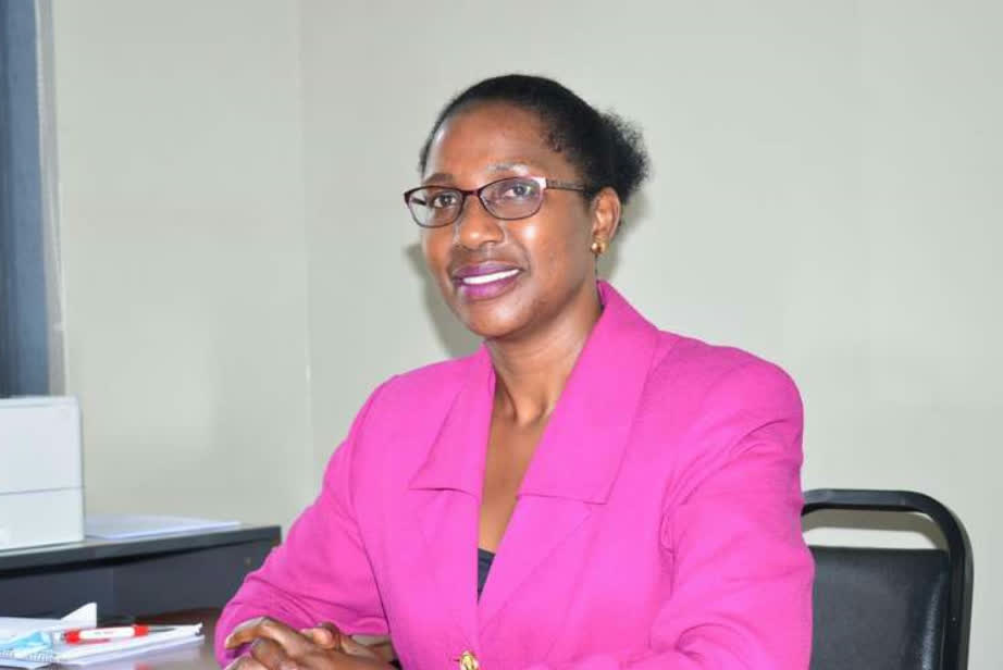 Safina Naggayi, Chief Executive Officer of Bakaluba Engineering Consults, at her desk.